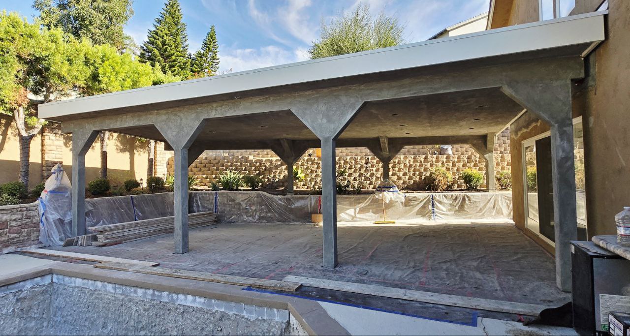 San Diego patio construction project featuring new concrete columns, roofing, and structural framing by Elite Built LLC.